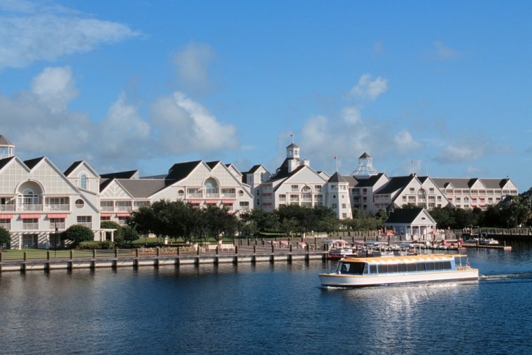 Disney's Yacht Club Resort, located on Florida's Crescent Lake, provides visitors with pontoon boats and a waterslide.